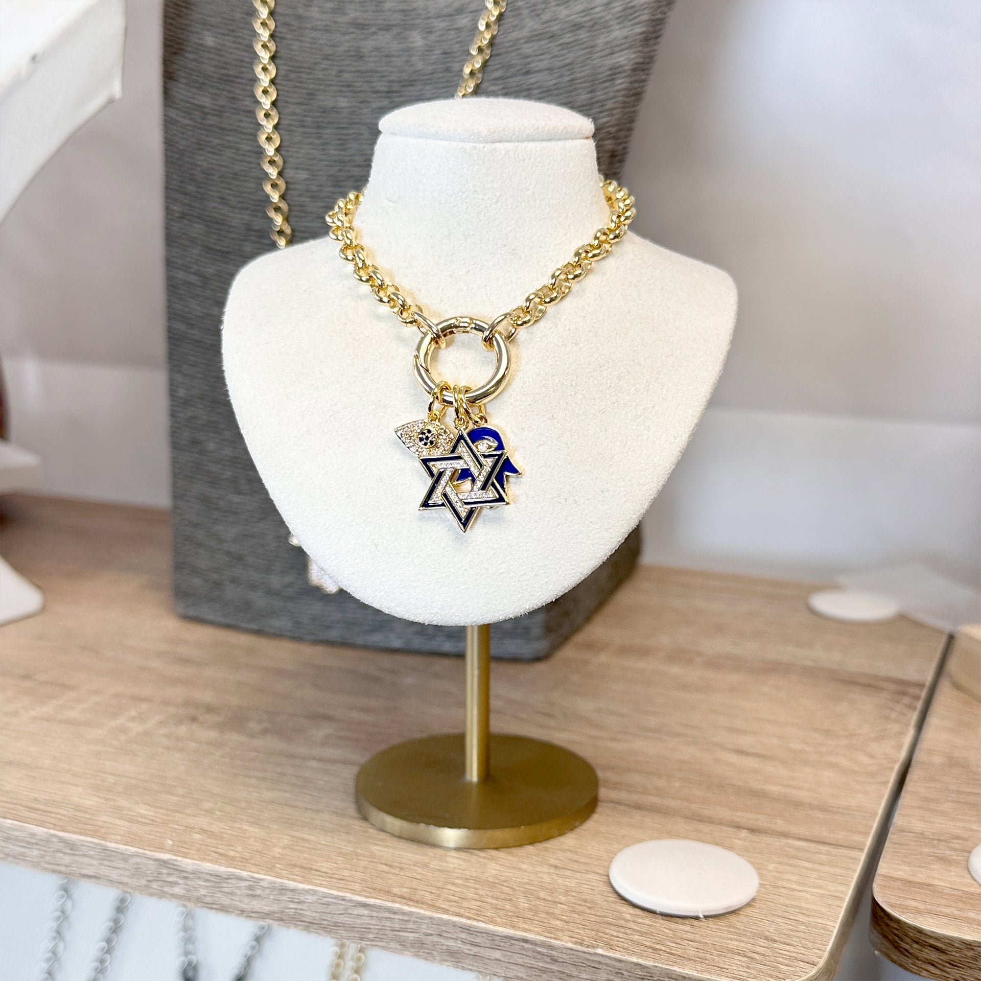 Gold Marcia Enamel Hamsa Charms with eye design in blue, red, white, black, and turquoise