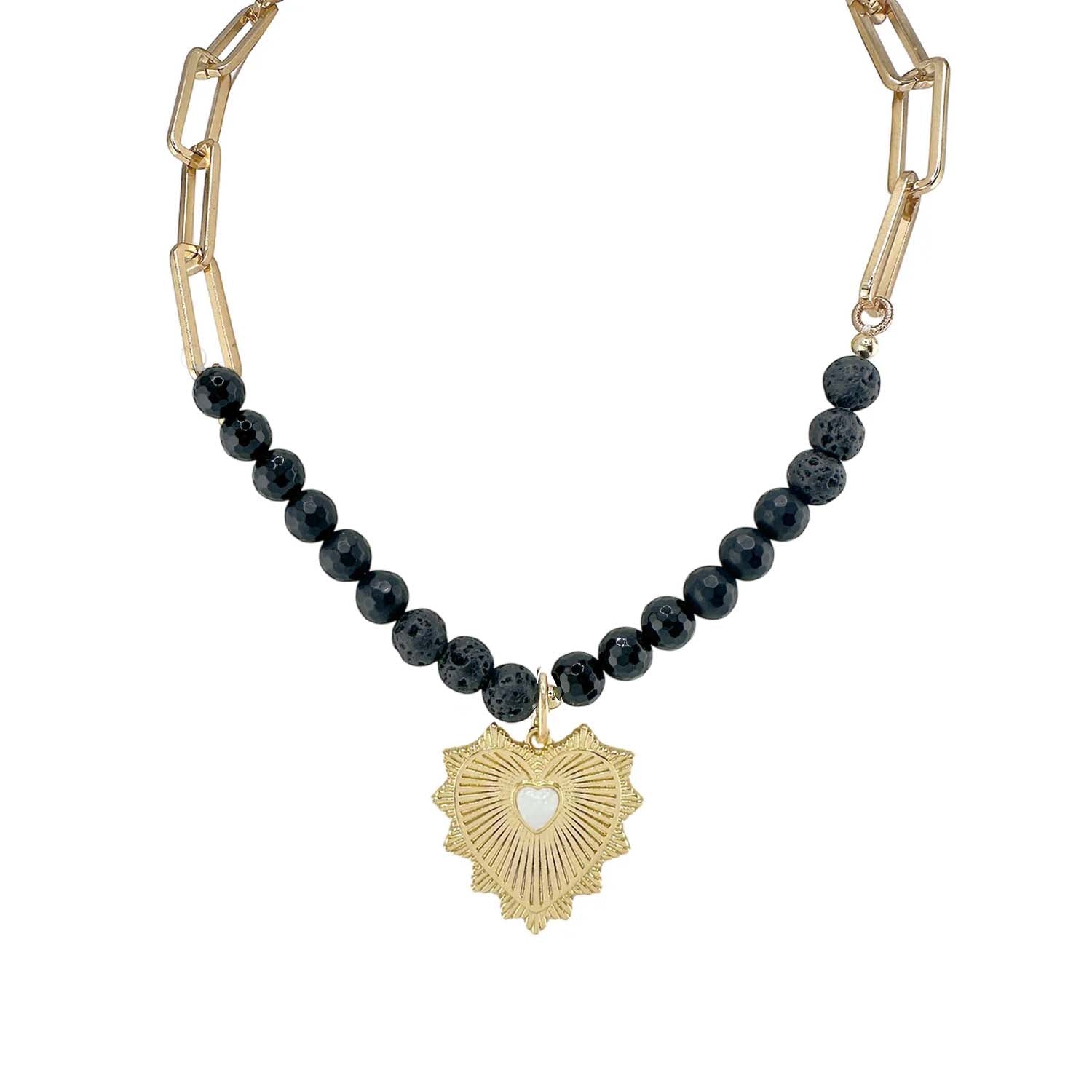 Necklace with black beads and a gold heart pendant on a white background