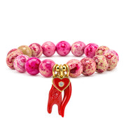 Love Lisa Mariano Italian Horn Gemstone Protection Bracelet with bright pink fossil gemstone beads, red enamel crystal heart, red Italian horn, and red mano cornuto protection charms on white
