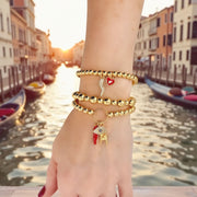 Love Lisa Italian protection bracelet stack worn layered with gold beaded charm bracelets