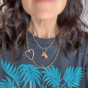 love lisa mariano italian protection charm necklace gold on model with cornicello evil eye and mano charms