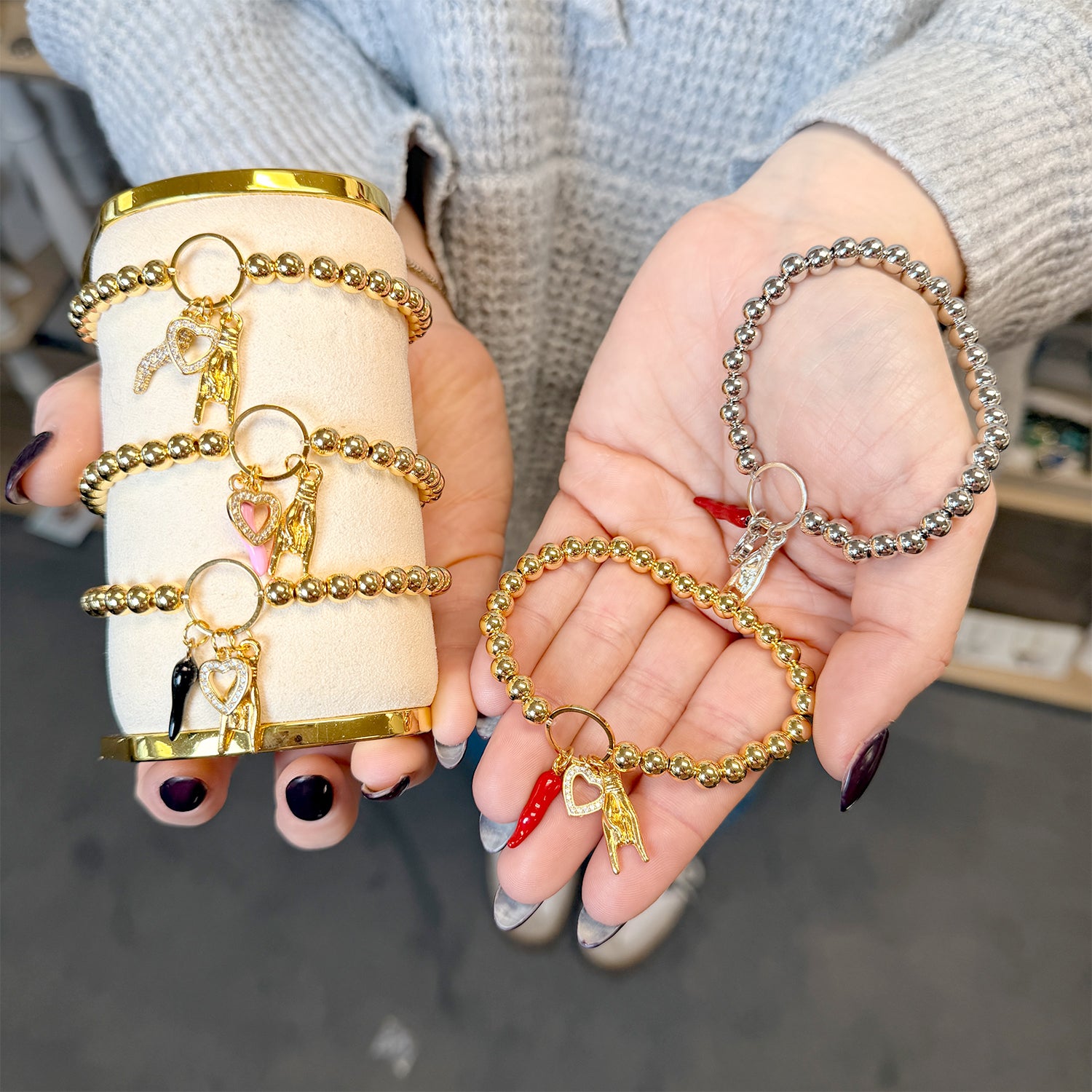 Love Lisa Mariano love protection bracelet silver worn on wrist with heart and horn charms