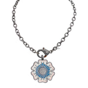 Martina Flower Charm in blue enamel paired with Tina’s Everyday Necklace featuring pavé clasp