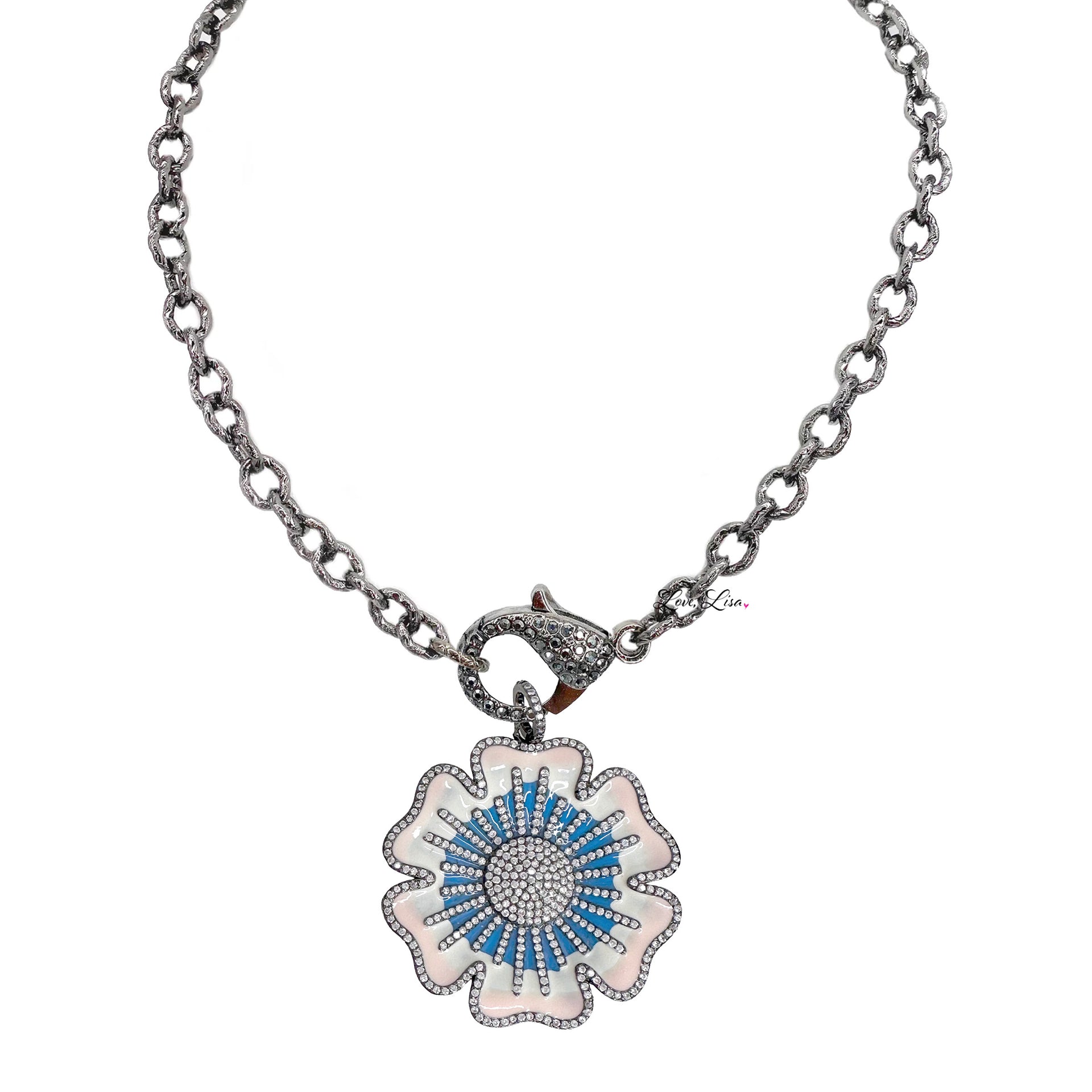 Martina Flower Charm in blue enamel paired with Tina’s Everyday Necklace featuring pavé clasp