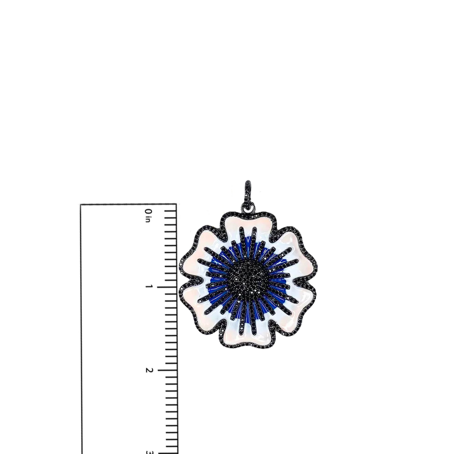 Martina Flower Charm in black and blue enamel with pavé stones shown next to ruler, measuring 1.85 inches