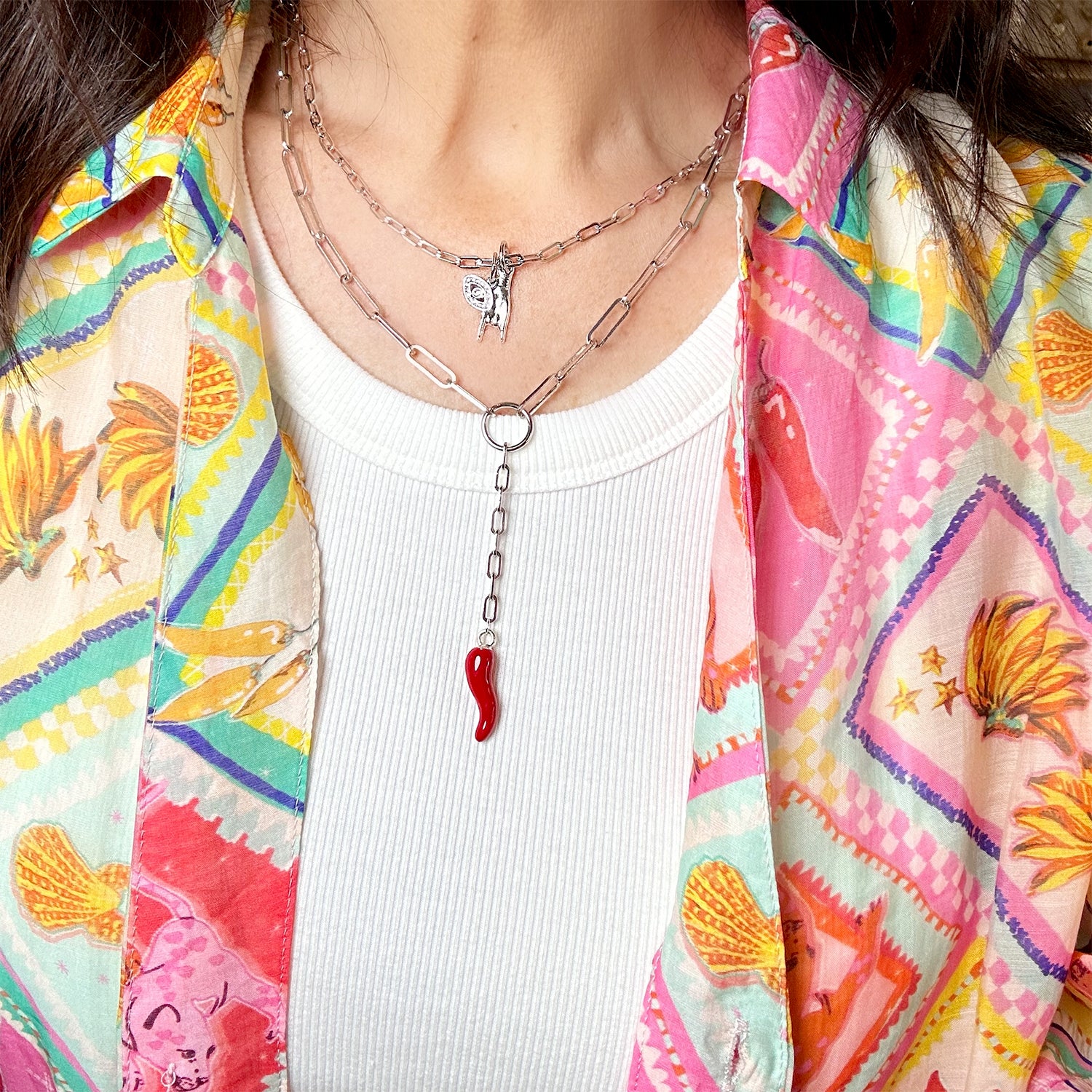 Woman wearing the martina horn necklace in silver