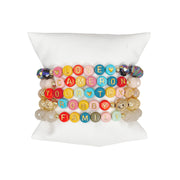 Custom colorful beaded bracelet with gold letter charms that can spell any name or word