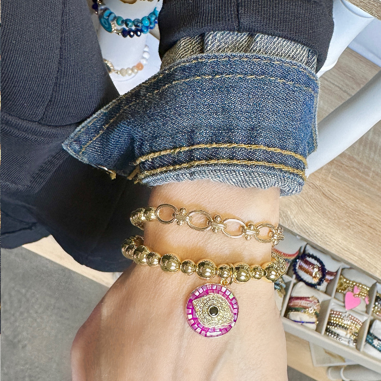 Gold beaded mi bracelet on model