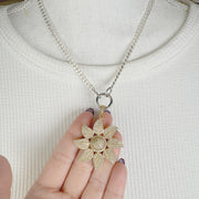 Love Lisa Mia Flower Charm gold pave floral pendant closeup model jewelry styling