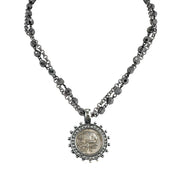necklace-gunmetal-gold-flatlay	gunmetal and gold skull coin charm necklace with dual chain and crystal detailing