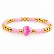 Mini Worry Stone Harper Luxe Crystal Rhythm Bracelet in Misty Rose with soft pink crystal beads, polished gold beads, and pink mini heart worry stone