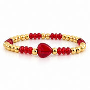 Mini Worry Stone Harper Luxe Crystal Rhythm Bracelet in Red with red crystal beads, polished gold beads, and red mini heart worry stone