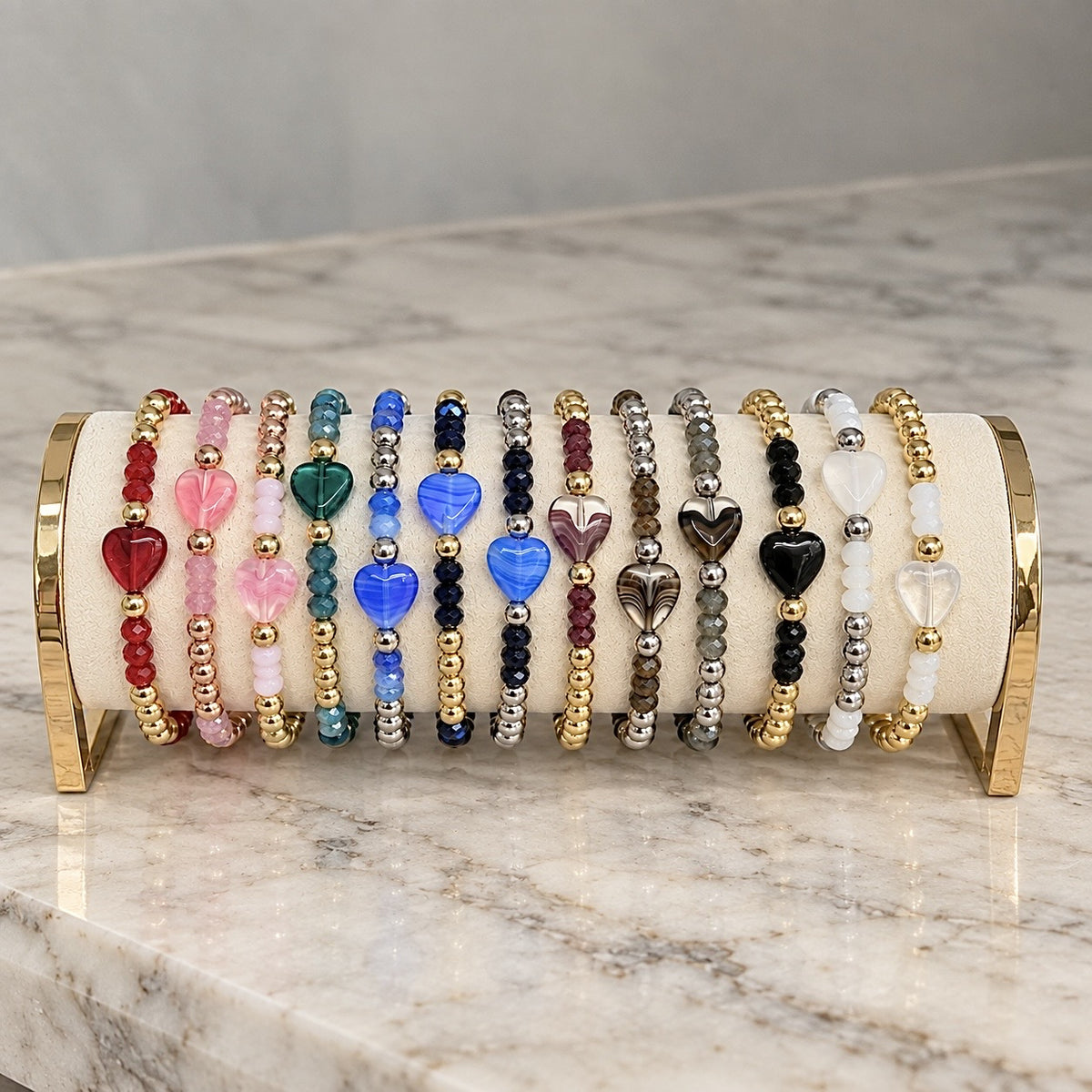 Love Lisa Mini Worry Stone Harper Luxe Crystal Rhythm Bracelets displayed on a bracelet bar in multiple colors with crystal beads and mini heart worry stones