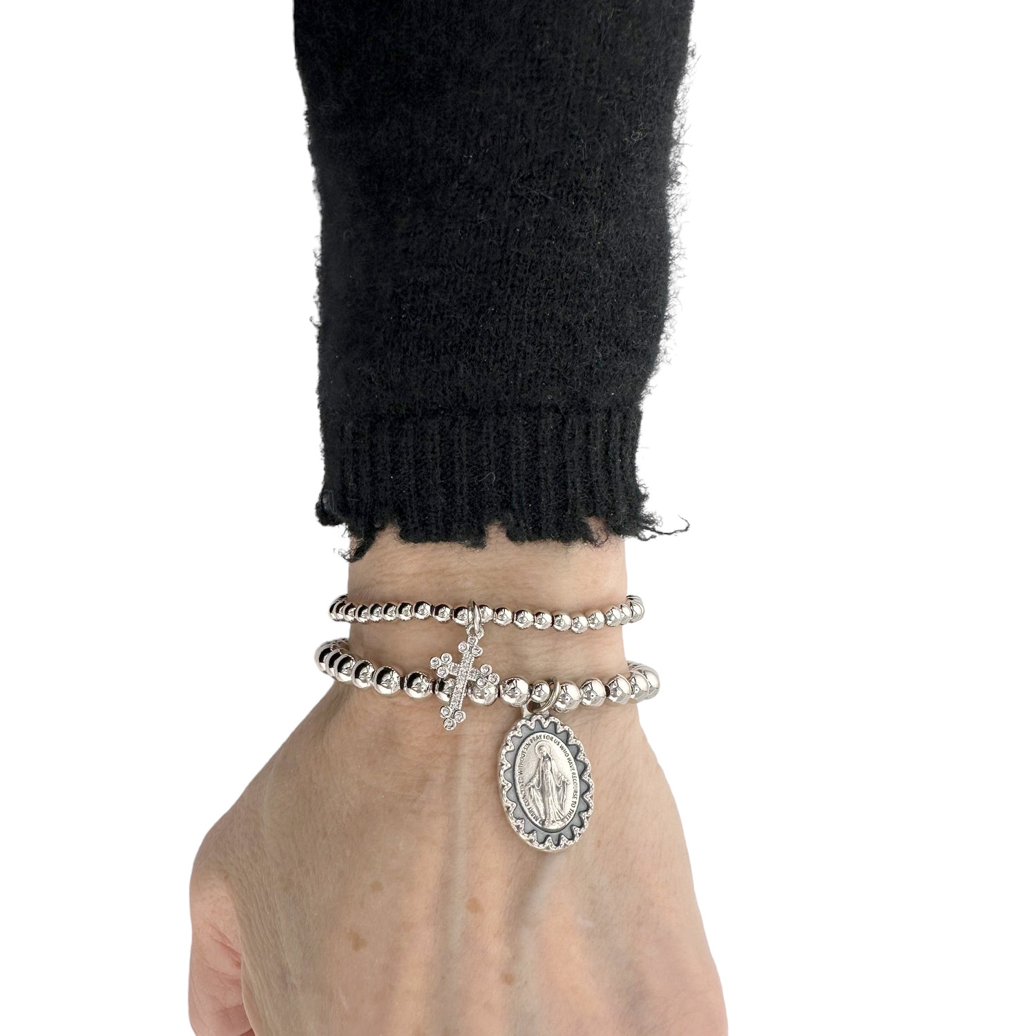 Miraculous Cross Set of Bracelets by Love Lisa silver version stacked on wrist