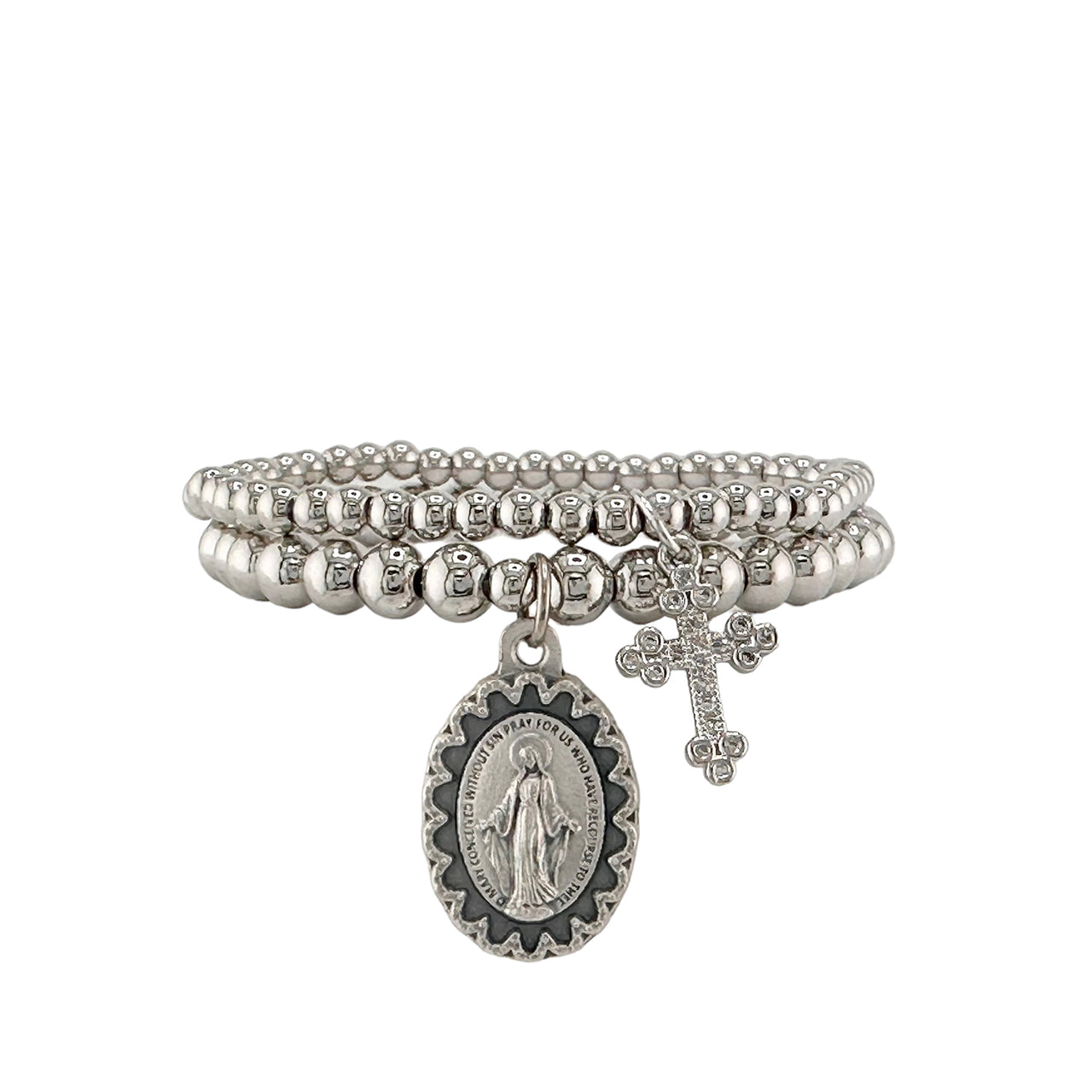 A set of two bracelets, one with a cross charm and the other with a miraculous medal, both featuring silver colors and adorned with small beads.