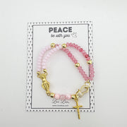 Miraculous Rosary pink and gold bracelet shown with Peace be with you packaging card Catholic gift jewelry
