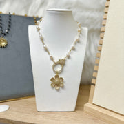 Love Lisa flower charm necklace display layered floral jewelry