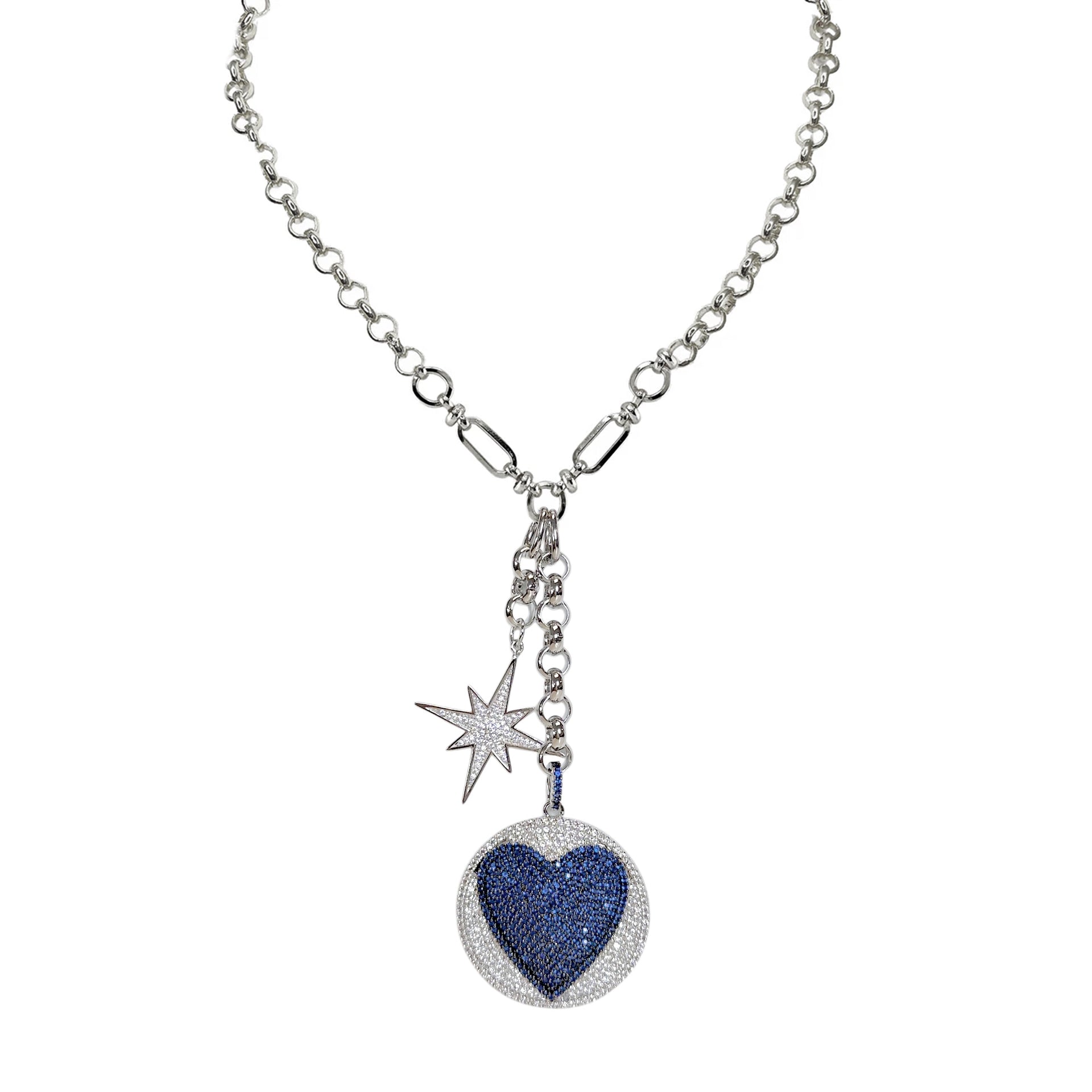 Lariat necklace with heart medallion and starburst charm in silver finish

