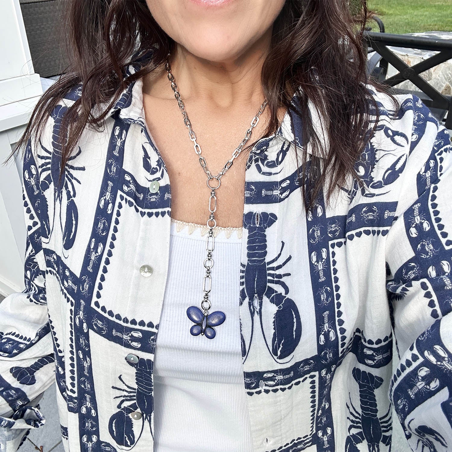 Monarch butterfly necklace in silver and blue