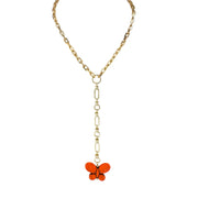 Gold chain necklace with a butterfly pendant on a white background