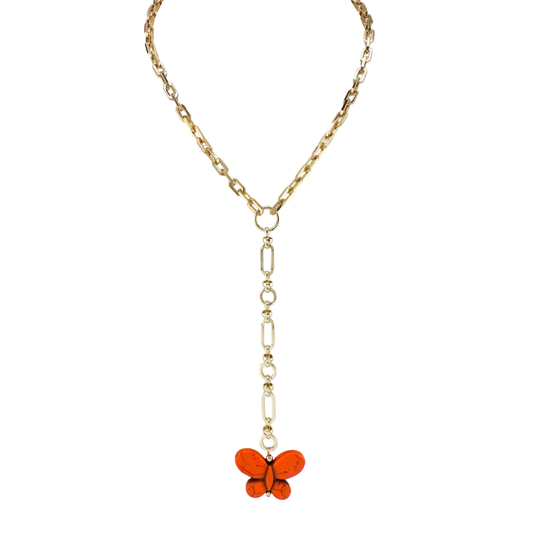 Gold chain necklace with a butterfly pendant on a white background