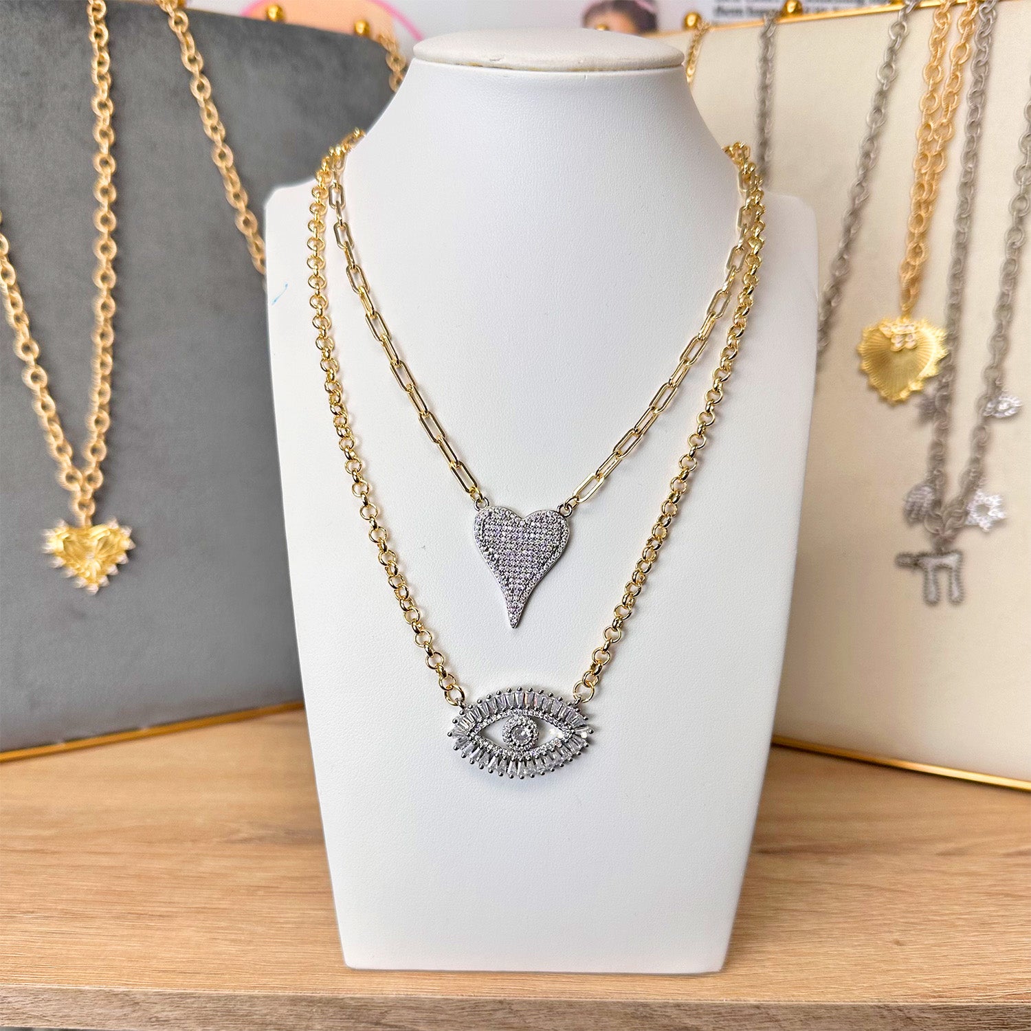 evil eye delicate necklaces styled in layered look with gold and silver chains