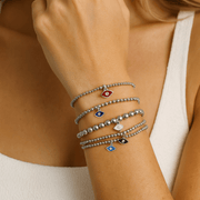 Love Lisa mini evil eye bracelet stack worn on wrist layered beaded bracelet styling