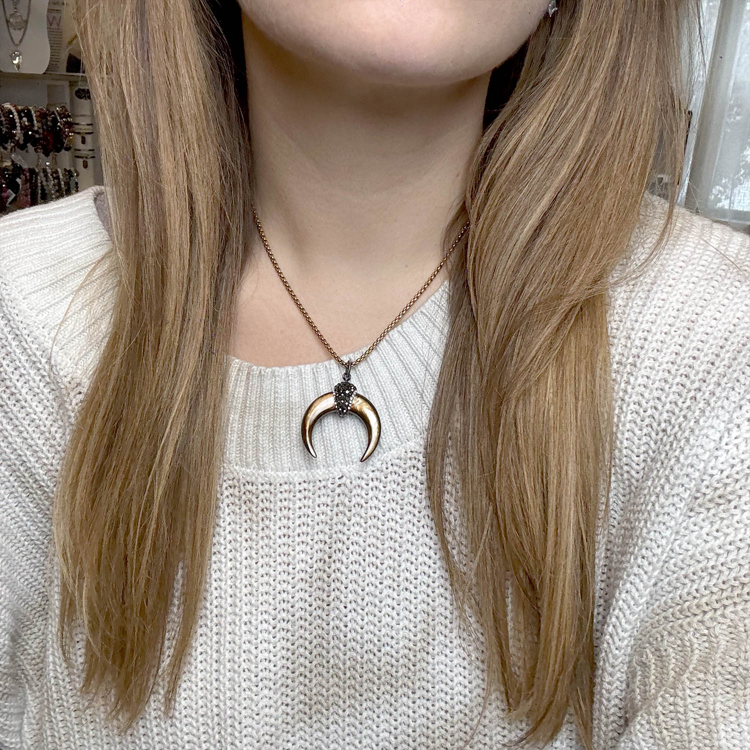 model wearing gold natural shell horn pendant necklace with crystal pave cap by Love Lisa jewelry