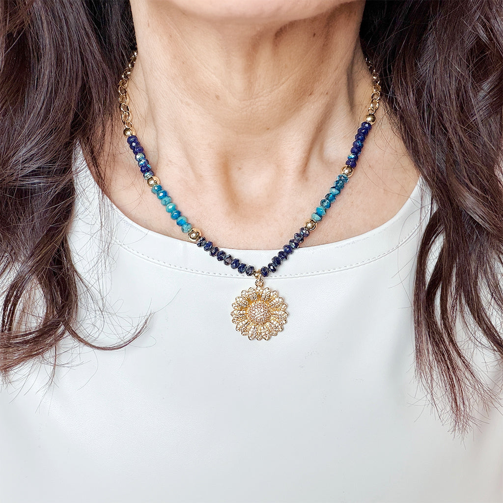 Love Lisa blue sunflower beaded necklace worn on model layered crystal bead necklace with pavé charm