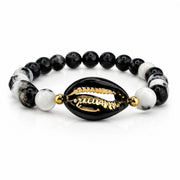 Ocean Tide Beaded Shell Bracelet in Midnight Tide with black and white gemstone beads black shell centerpiece and gold detailing