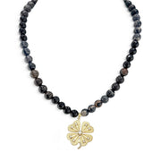 Paloma Lucky Clover Sea Sediment Jasper Necklace in Midnight Tide with black stone beads and sparkling clover pendant