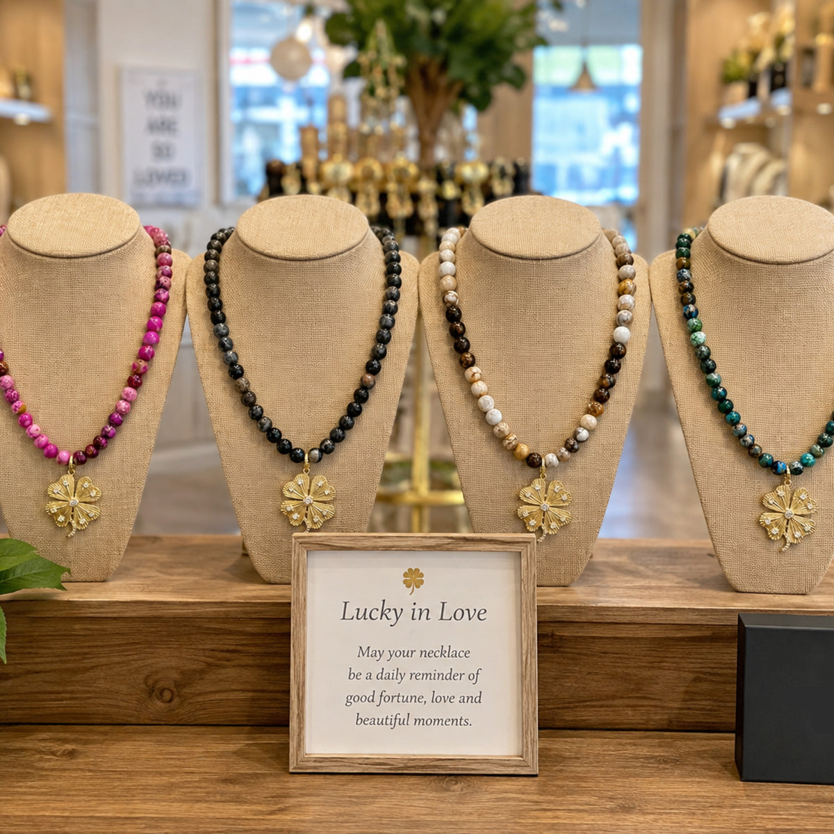 Love Lisa Paloma Lucky Clover Sea Sediment Jasper Necklaces displayed in multiple colorways with clover pendants