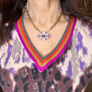 model wearing patricia eye necklace with crystal charm

