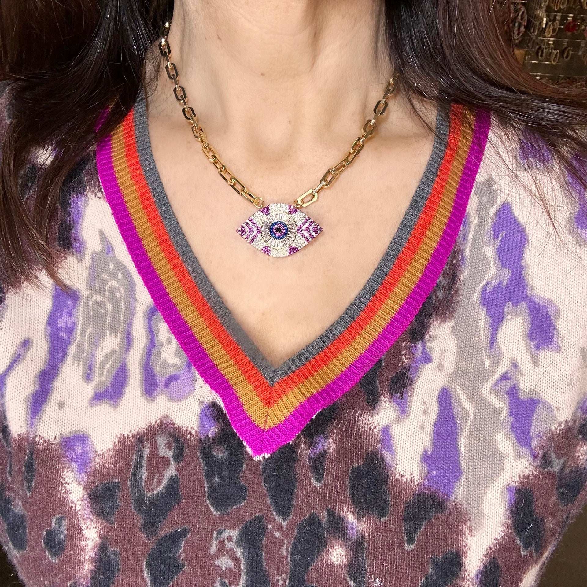 model wearing patricia eye necklace with crystal charm

