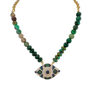 Necklace with green beads and an eye-shaped pendant on a white background