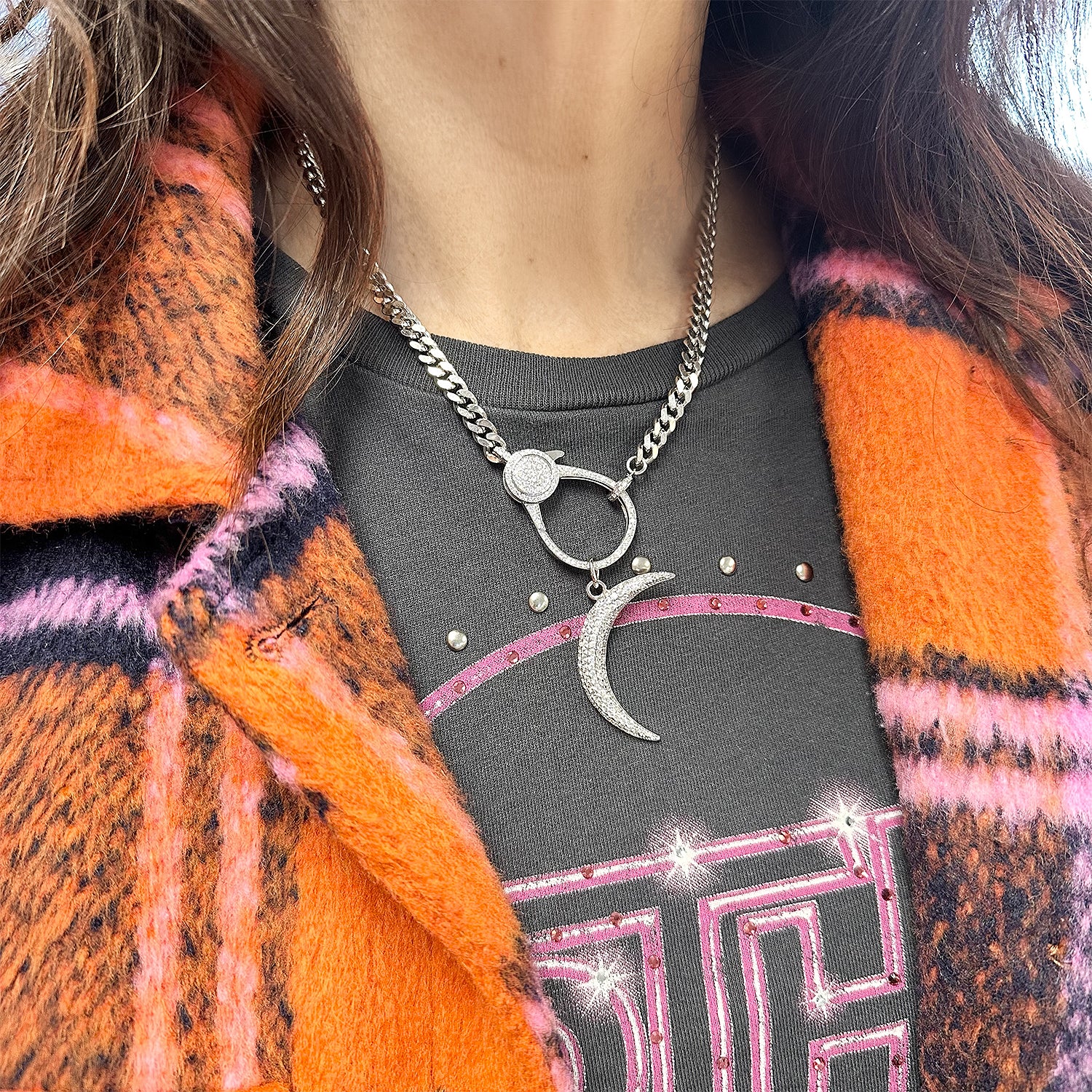 Model wearing Pavé Moon Charm on silver clasp necklace with tee and plaid orange coat