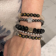 Love Lisa Pawfect Beaded Bracelet stacked on wrist with multiple finishes

