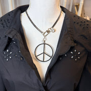 Love Lisa peace keeper statement necklace gunmetal pavé peace sign removable charm on mannequin 