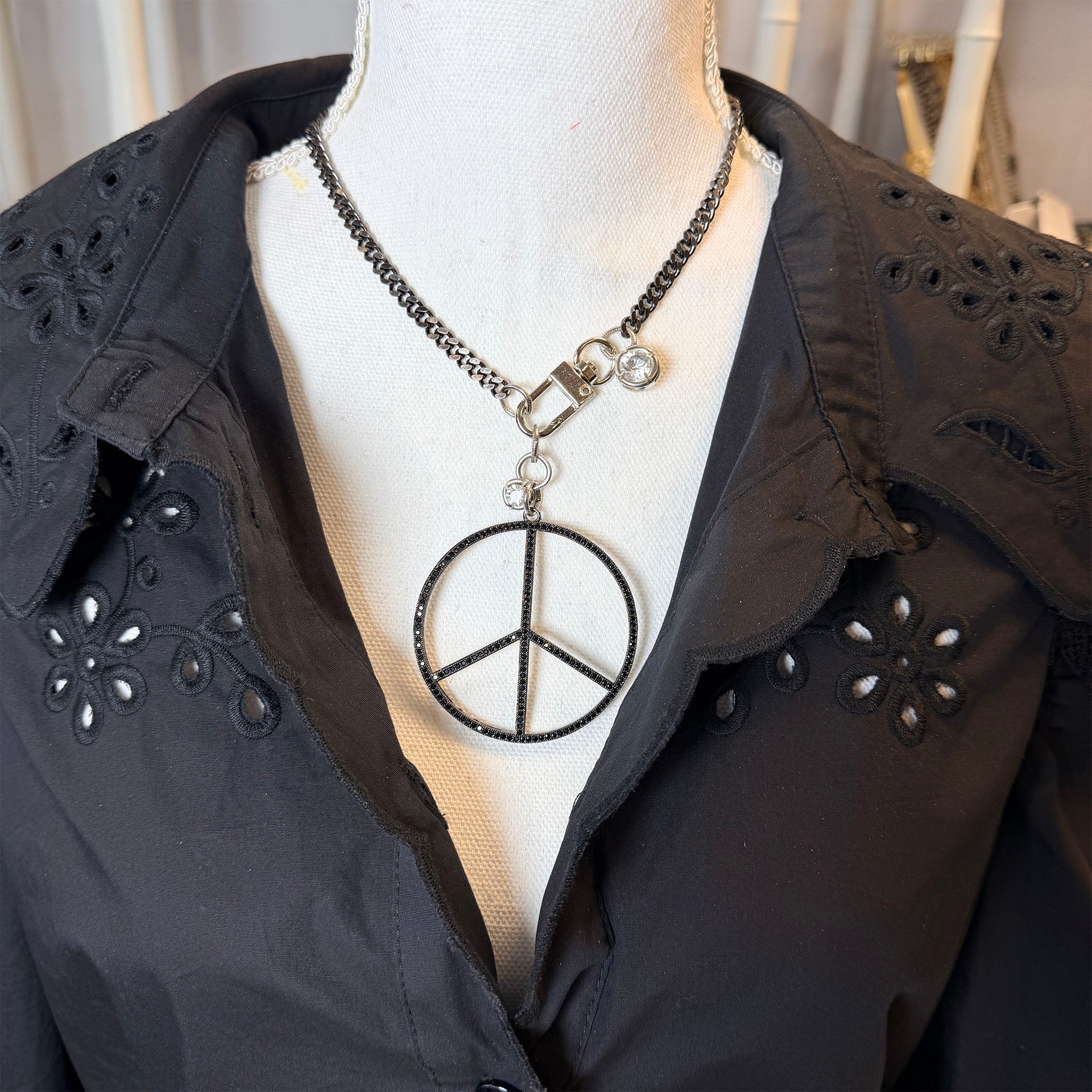 Love Lisa peace keeper statement necklace gunmetal pavé peace sign removable charm on mannequin 