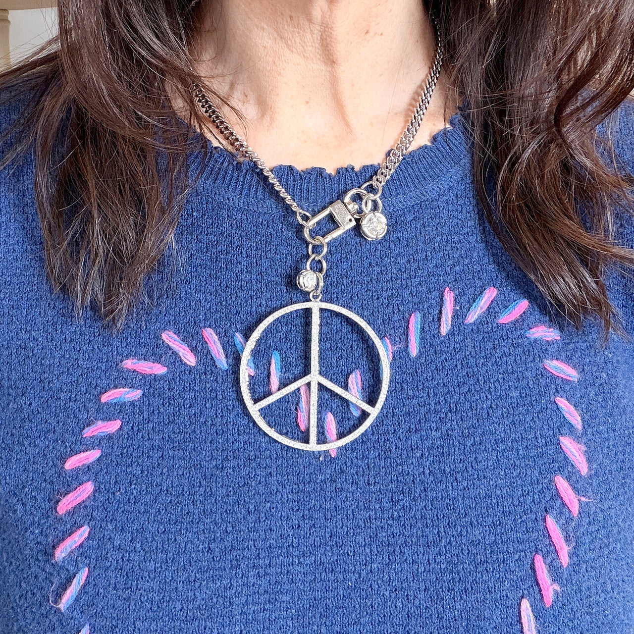 Love Lisa peace keeper statement necklace  and hanging crystal accents worn silver pavé peace sign statement look