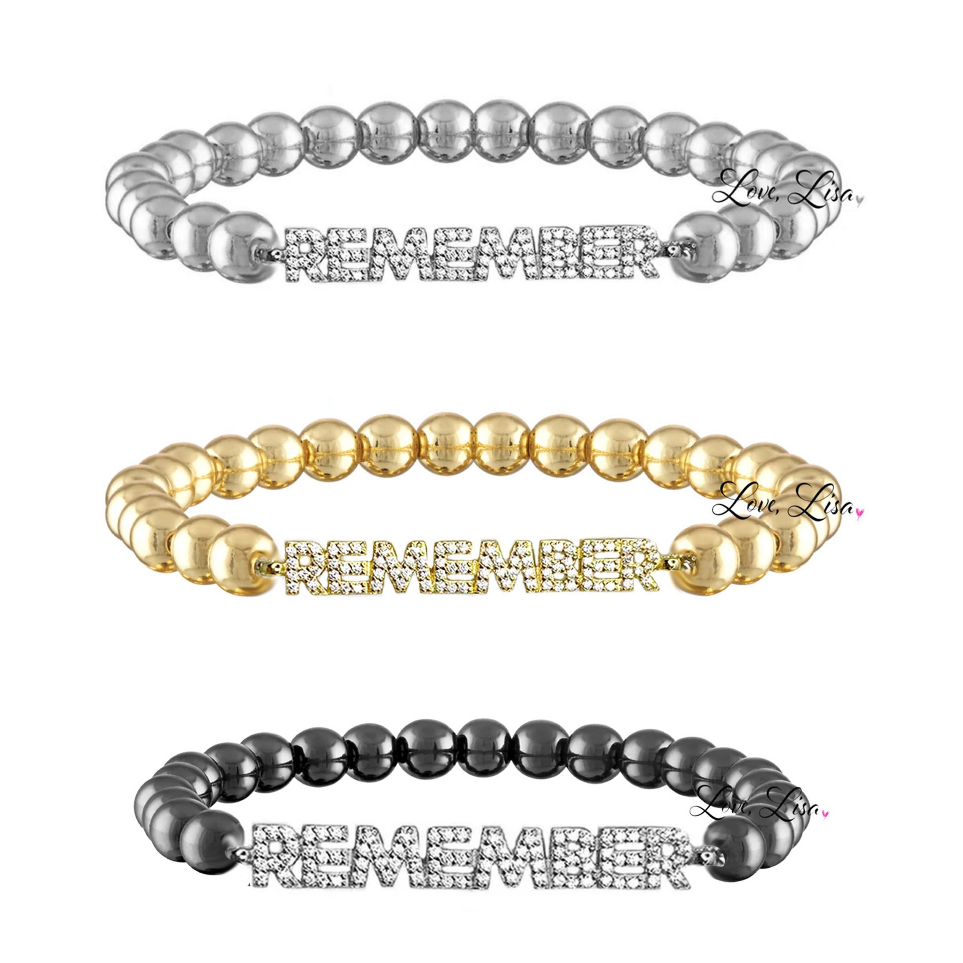 Three beaded bracelets in silver, gold, and black with embedded stones on a white background.
