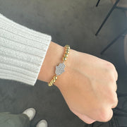 Love Lisa beaded hamsa bracelet gold with pavé crystal charm stretch design worn on wrist