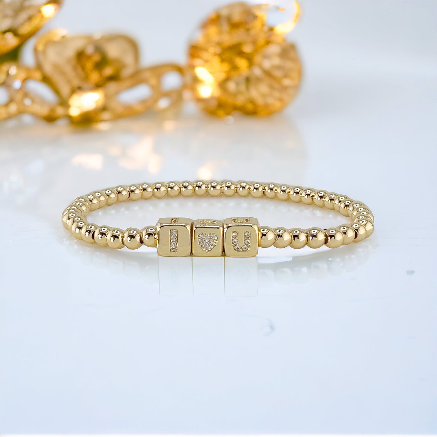 gold personalized block letter bracelet with gold cubes spelling custom name by love lisa