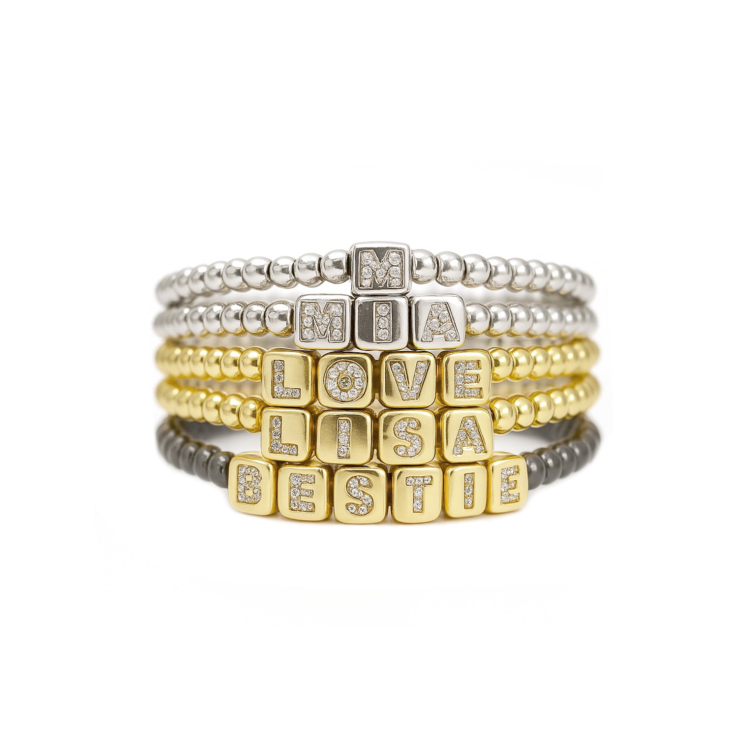 stack of personalized block letter bracelets in silver gold and gunmetal finishes by love lisa