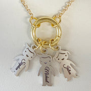 personalized grandma kids name charm necklace detail with engraved child charms on open center ring