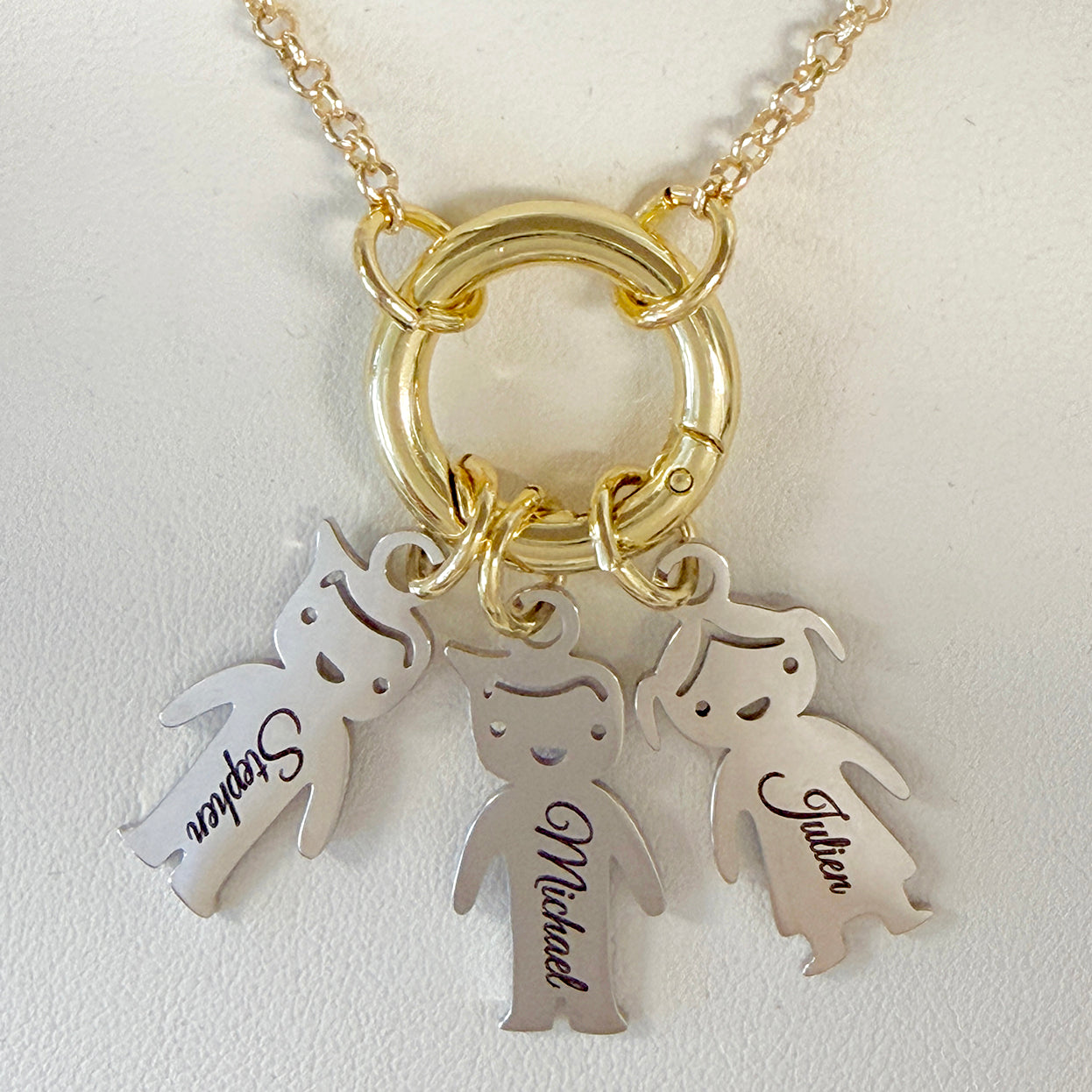 personalized grandma kids name charm necklace detail with engraved child charms on open center ring