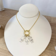 Love Lisa personalized grandma kids name charm necklace displayed on jewelry bust with custom engraved charms