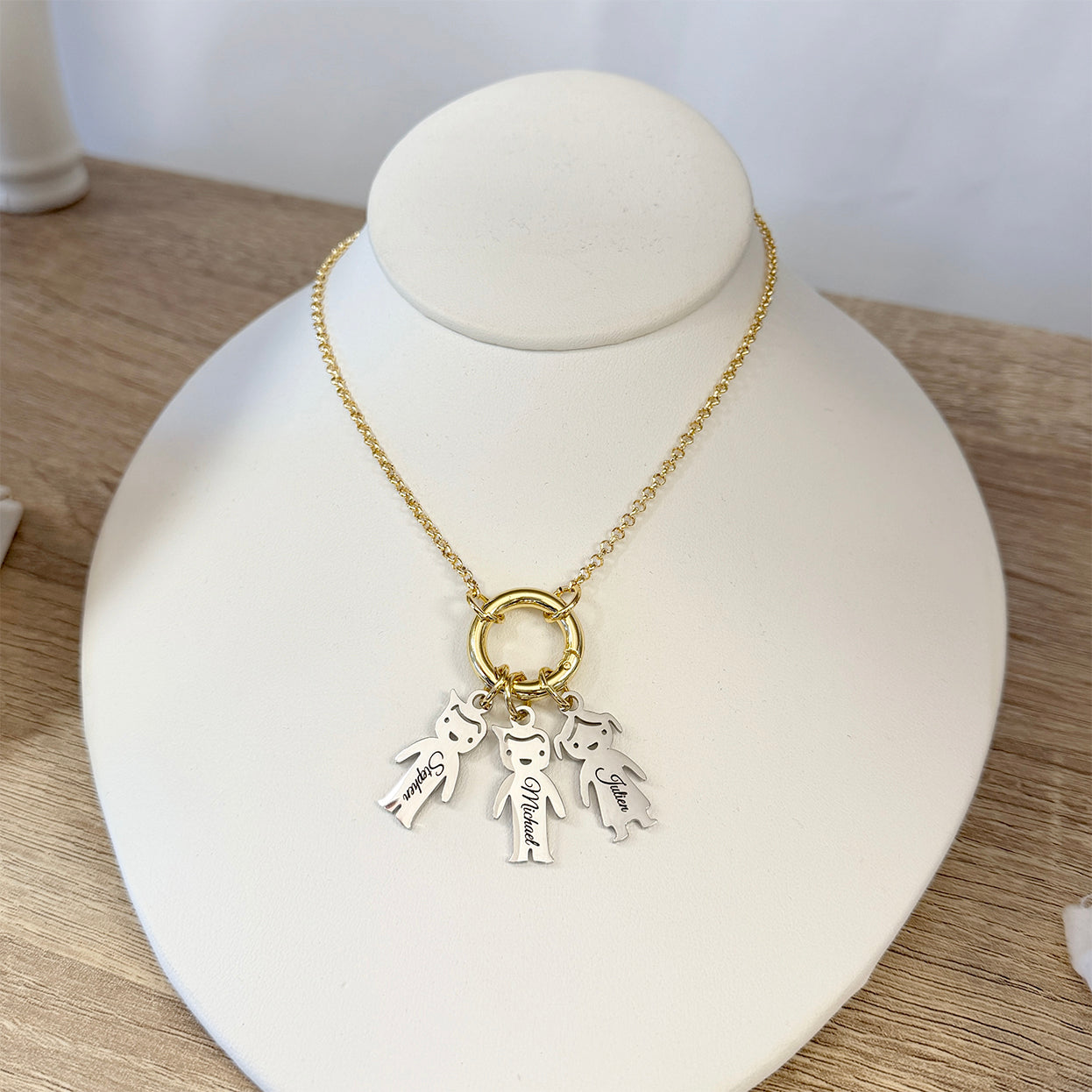 Love Lisa personalized grandma kids name charm necklace displayed on jewelry bust with custom engraved charms