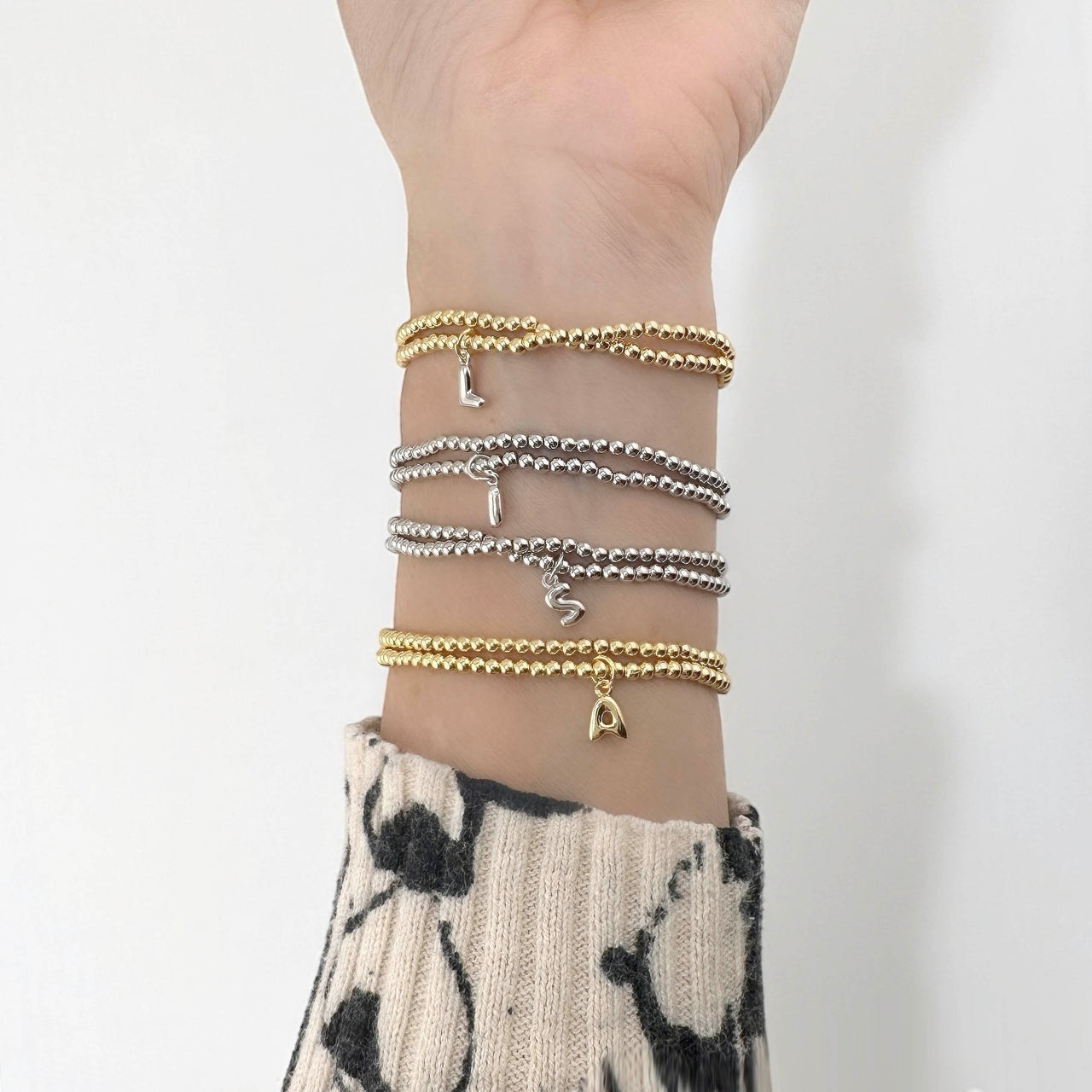 model wearing gold personalized initial double wrap bracelet love lisa jewelry