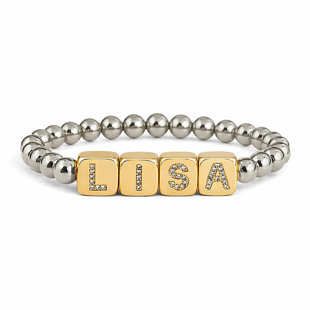 personalized large block letter bracelet in gold spelling LISA with bold cube letters and polished 6mm beads